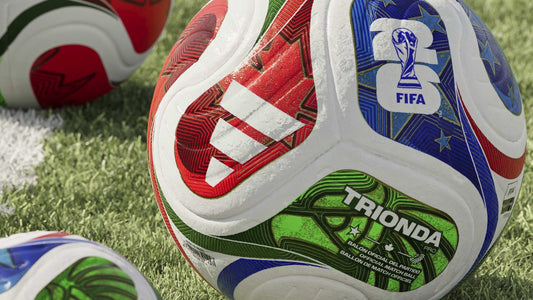 adidas Trionda Pro match balls on a grass pitch