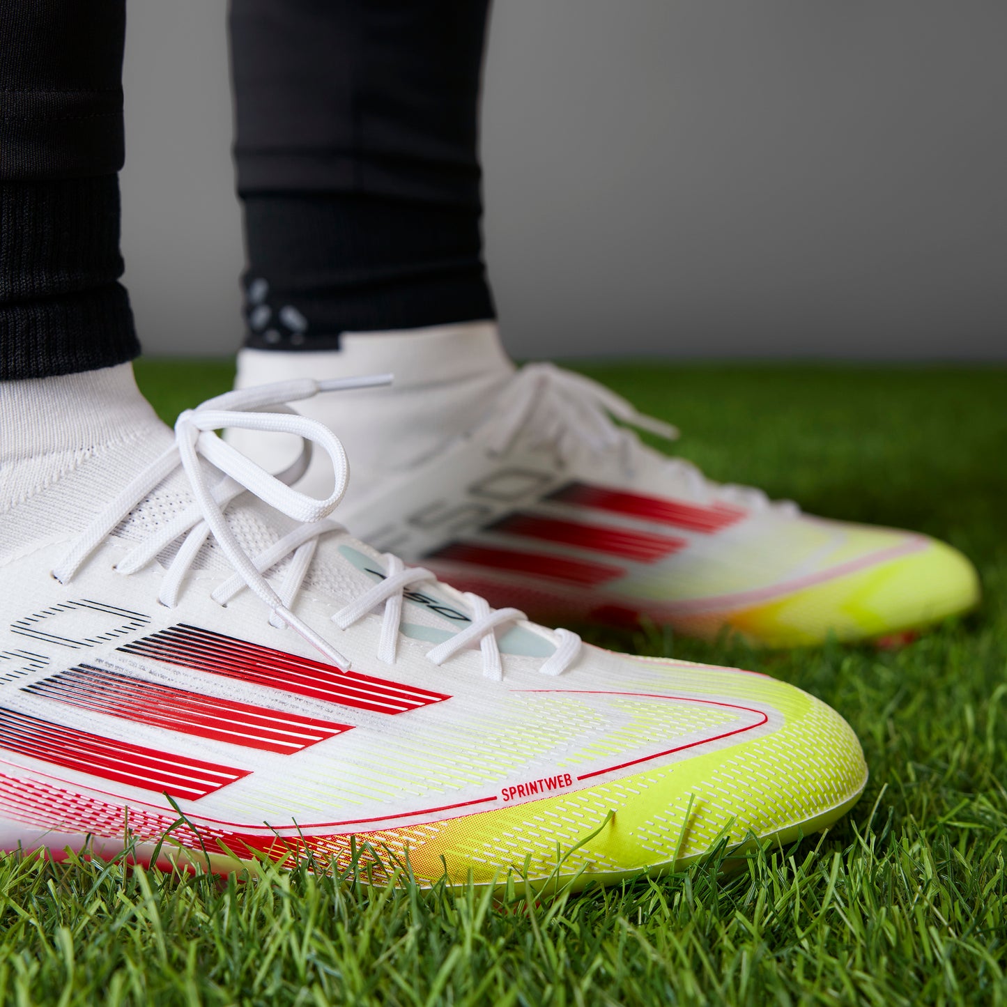 adidas F50 Elite Mid-Cut Women FG - Cloud White / Lucid Red / Solar Yellow