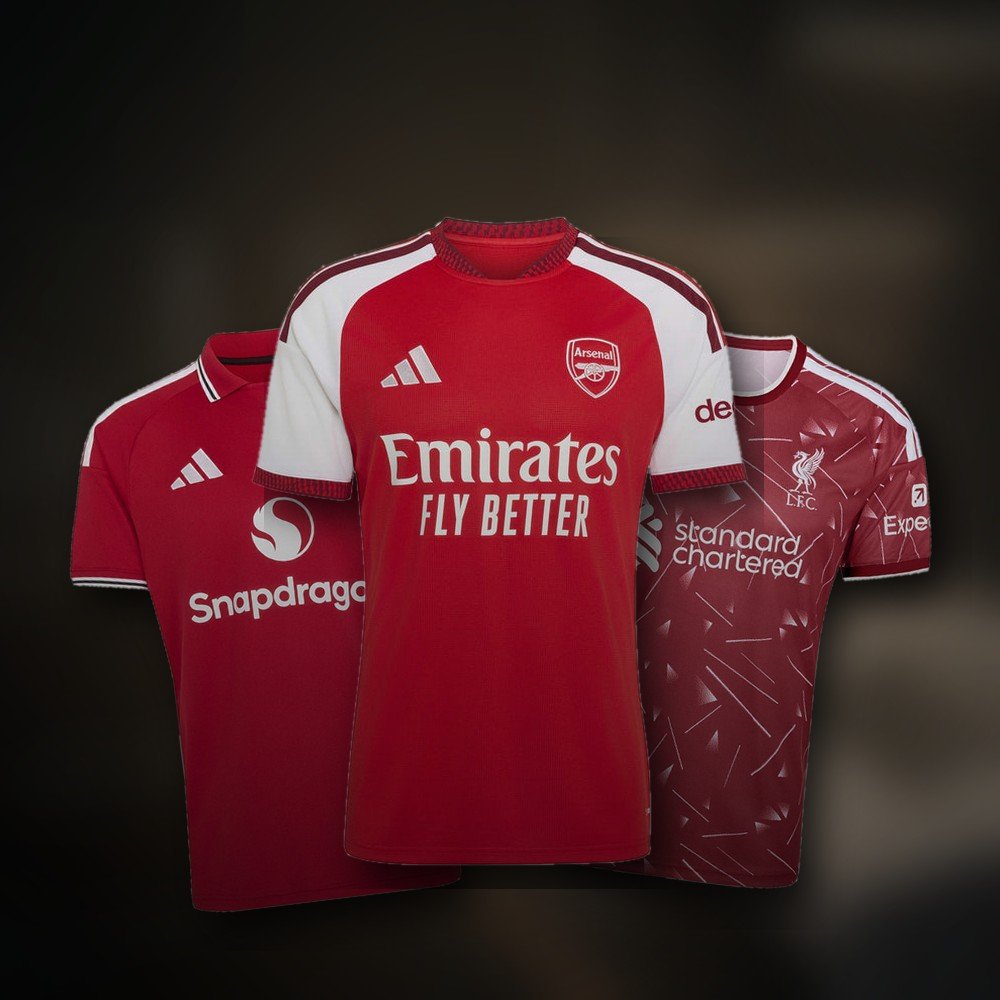 Manchester United, Arsenal and Liverpool home jerseys under workshop light
